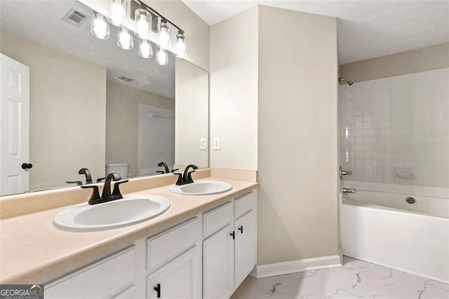 full bath with marble finish floor, a sink, visible vents, and baseboards