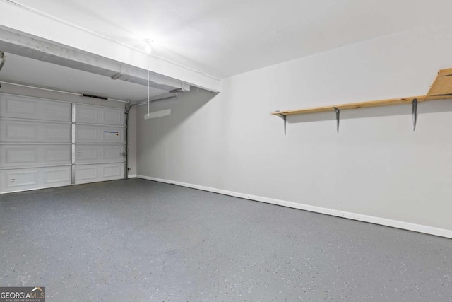 garage featuring baseboards