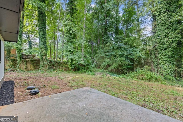 view of yard featuring a patio area and fence