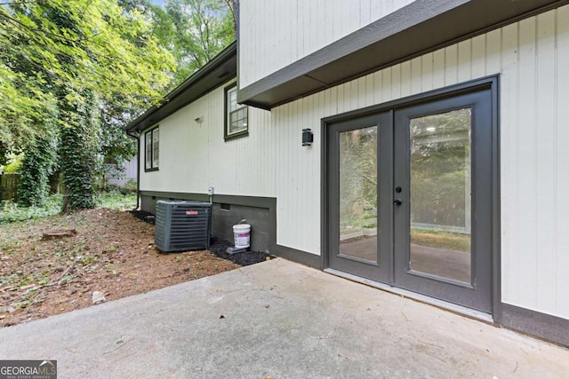 doorway to property featuring central AC, french doors, and a patio