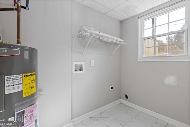 washroom with marble finish floor, water heater, hookup for an electric dryer, laundry area, and baseboards