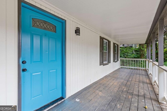 entrance to property featuring covered porch