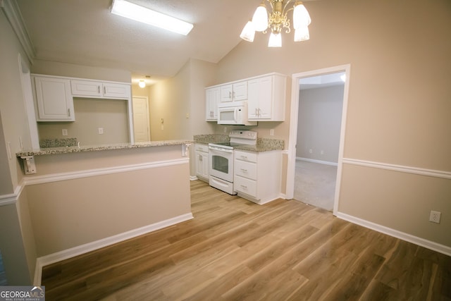 kitchen featuring light wood-style flooring, a peninsula, white appliances, white cabinets, and vaulted ceiling