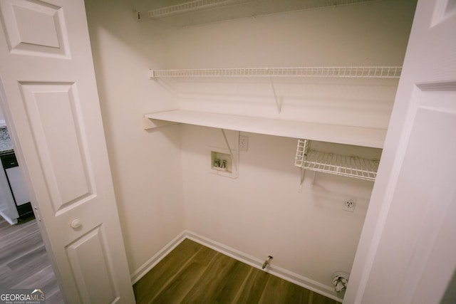 laundry room with laundry area, baseboards, dark wood finished floors, gas dryer hookup, and hookup for a washing machine