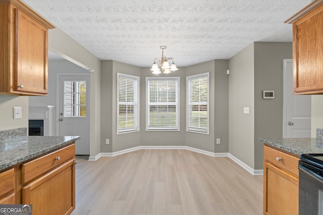 kitchen with brown cabinets and light wood-style flooring