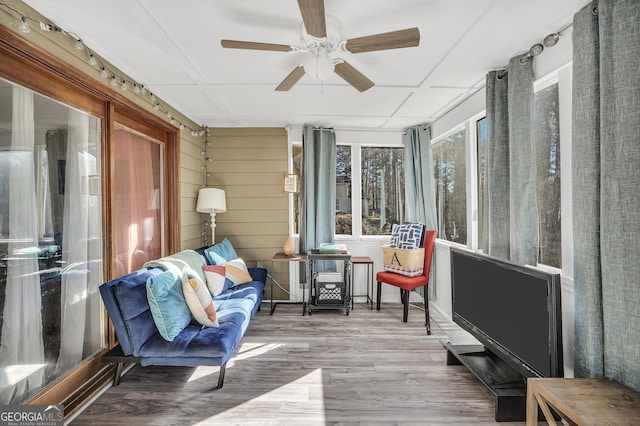 sunroom with a ceiling fan