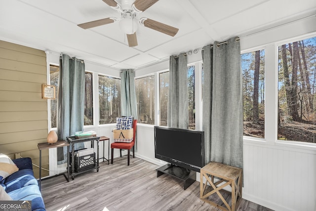 sunroom featuring ceiling fan