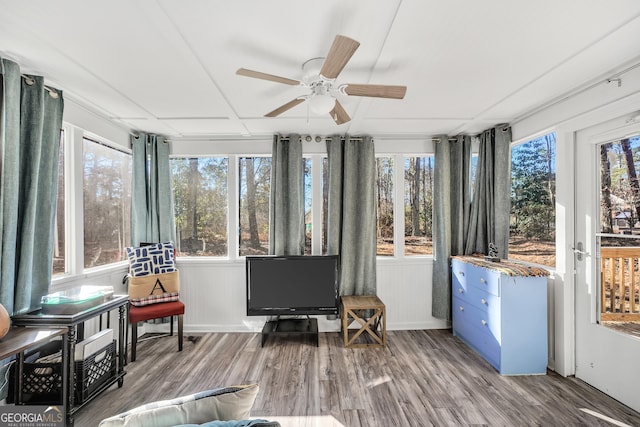 sunroom with a ceiling fan and plenty of natural light