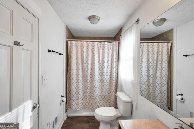 full bath featuring shower / bath combination with curtain, visible vents, toilet, a textured ceiling, and vanity