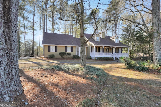 cape cod-style house featuring a porch