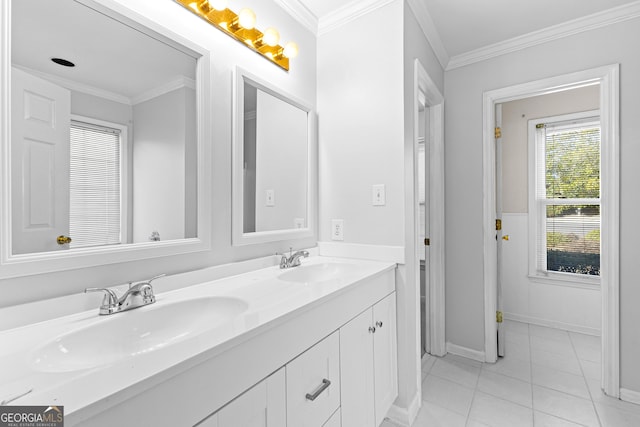 bathroom featuring double vanity, ornamental molding, a sink, and tile patterned floors