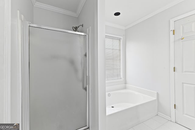 full bath featuring ornamental molding, a stall shower, a garden tub, and tile patterned floors