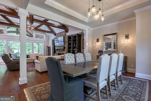 dining area with lofted ceiling with beams, a notable chandelier, wood finished floors, baseboards, and decorative columns