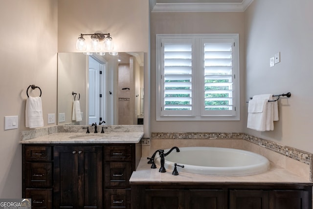 full bathroom featuring ornamental molding, vanity, and a bath