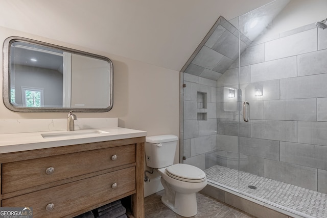 full bath with vaulted ceiling, vanity, a shower stall, and toilet