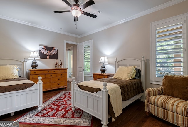 bedroom featuring ceiling fan, visible vents, wood finished floors, and ornamental molding