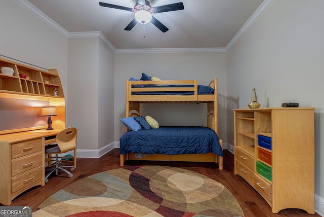 bedroom featuring ornamental molding, wood finished floors, built in study area, and baseboards