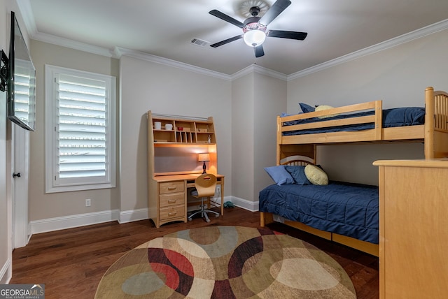 bedroom featuring baseboards, wood finished floors, and crown molding