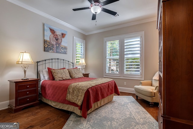 bedroom featuring baseboards, visible vents, ceiling fan, dark wood-style flooring, and crown molding