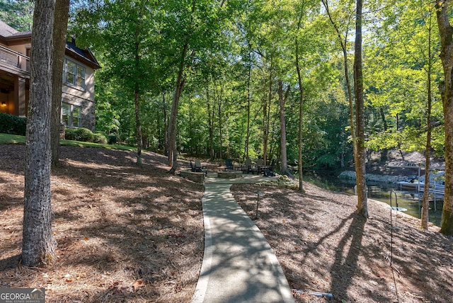 view of property's community featuring a forest view