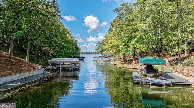 dock area with a water view and boat lift