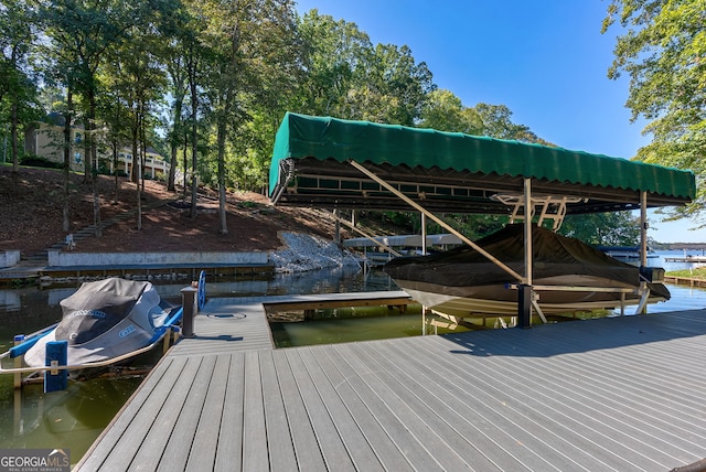 dock area featuring a water view and boat lift