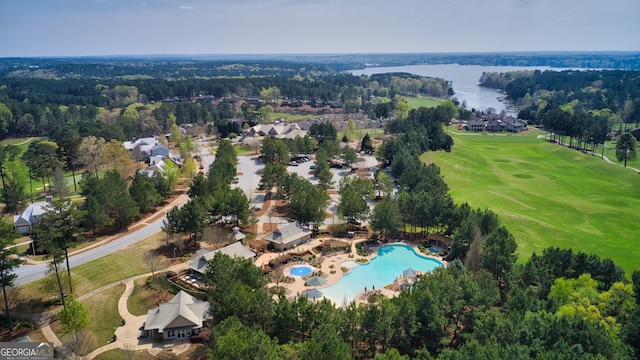 birds eye view of property featuring a water view and a forest view