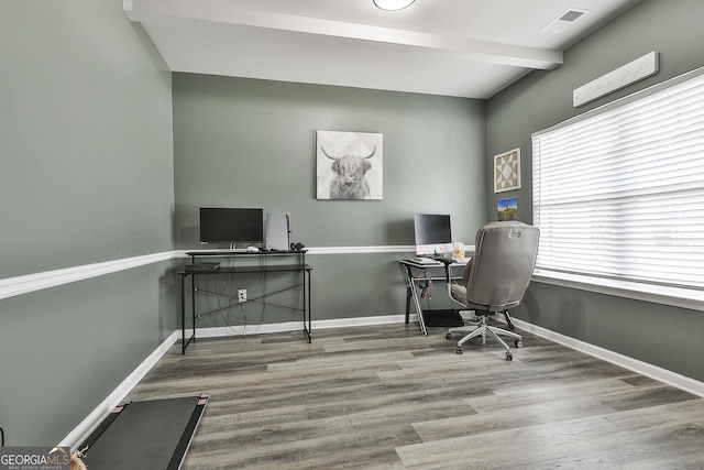 office featuring beam ceiling, wood finished floors, visible vents, and baseboards