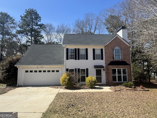 view of front of property with an attached garage, a chimney, concrete driveway, and roof with shingles