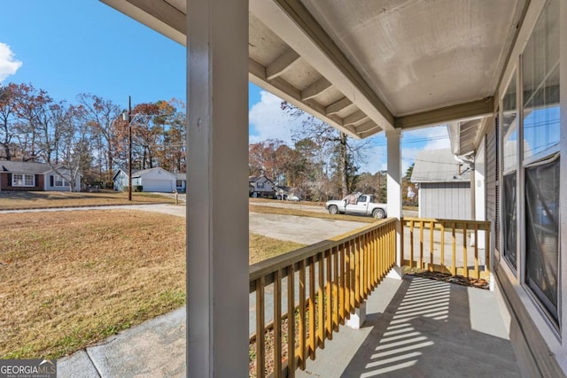 balcony with a porch and a residential view