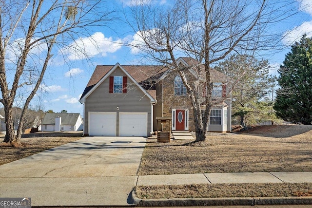 traditional-style house with an attached garage and concrete driveway