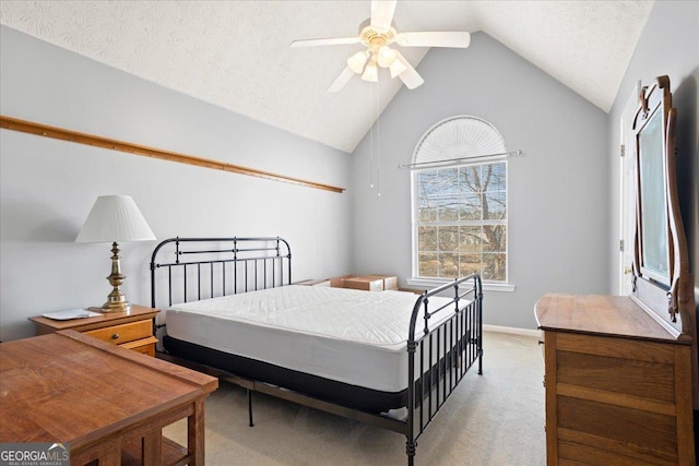 bedroom featuring a ceiling fan, light carpet, vaulted ceiling, a textured ceiling, and baseboards