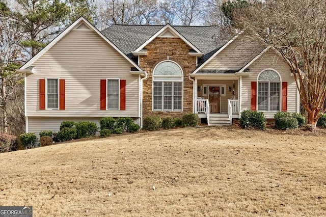 view of front of property featuring a shingled roof