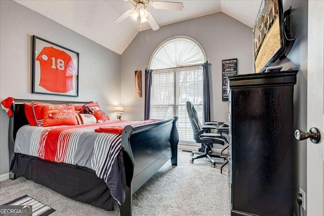 bedroom with lofted ceiling, carpet flooring, and a ceiling fan