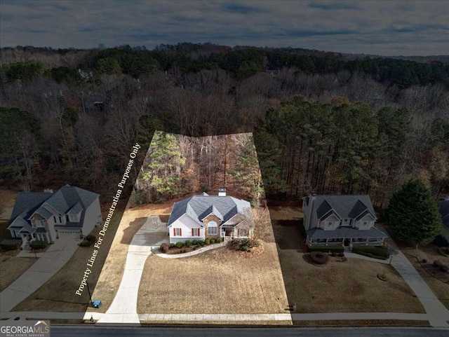 drone / aerial view featuring a view of trees