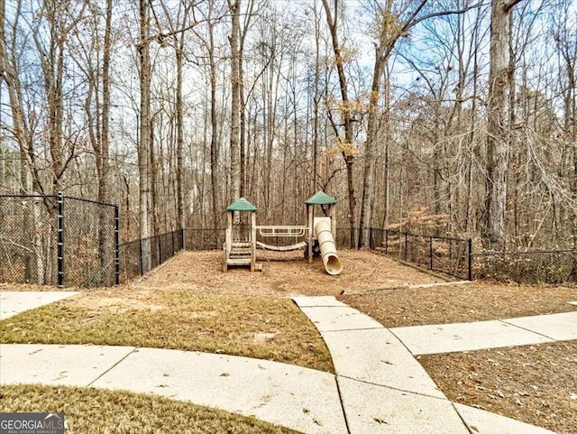 view of yard with fence and playground community