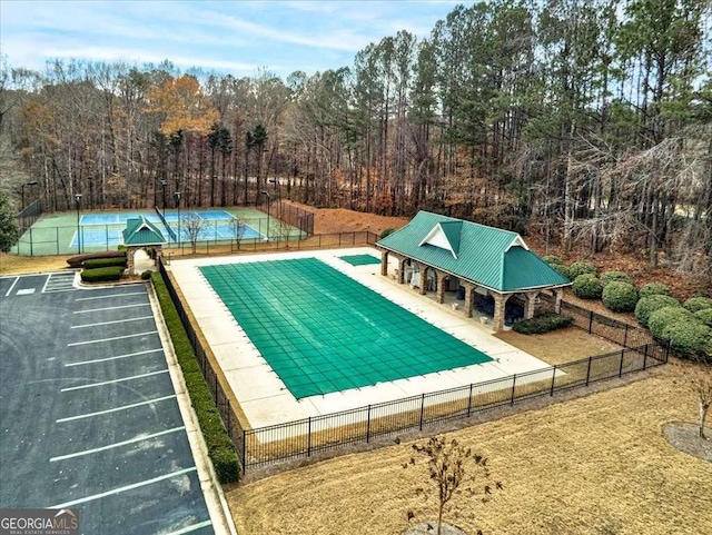 view of pool featuring fence