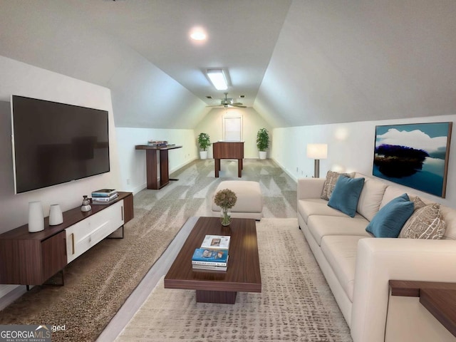 living room featuring carpet, baseboards, and vaulted ceiling