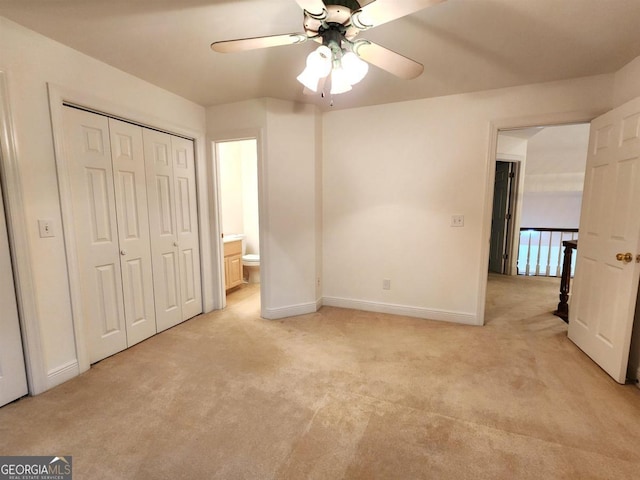 unfurnished bedroom with a closet, baseboards, a ceiling fan, and light colored carpet