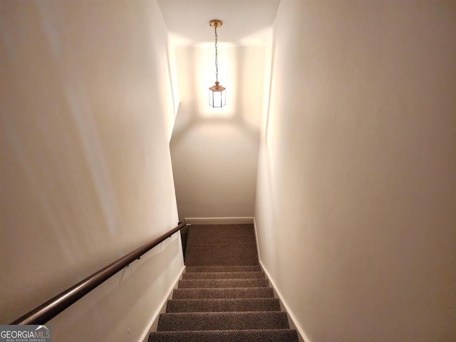 stairs with carpet flooring and baseboards