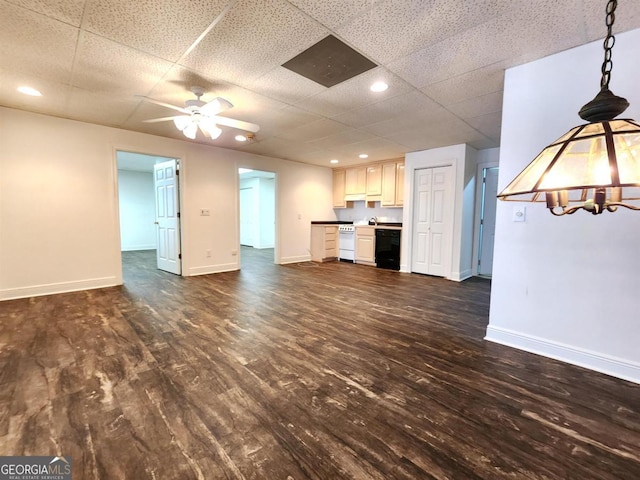 unfurnished living room featuring ceiling fan, baseboards, dark wood-type flooring, and recessed lighting