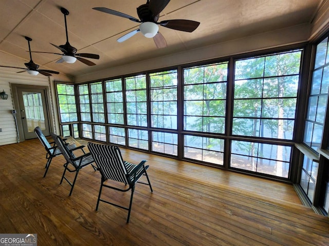 unfurnished sunroom with lofted ceiling