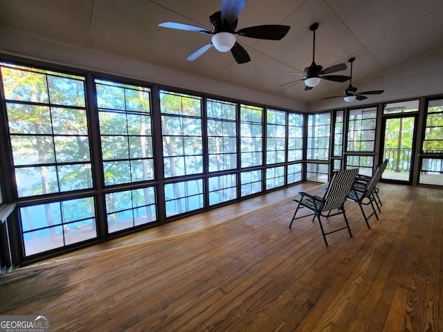 unfurnished sunroom with lofted ceiling