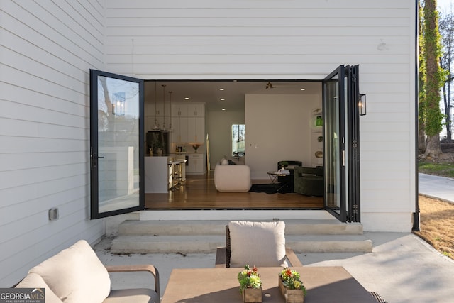 doorway to property with a garage