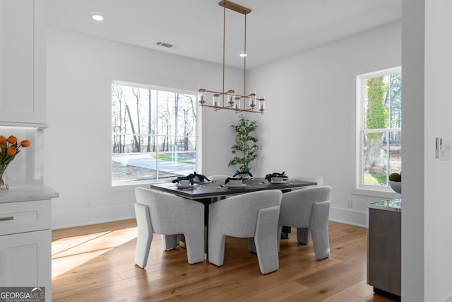 dining space featuring a chandelier, recessed lighting, visible vents, baseboards, and light wood-type flooring