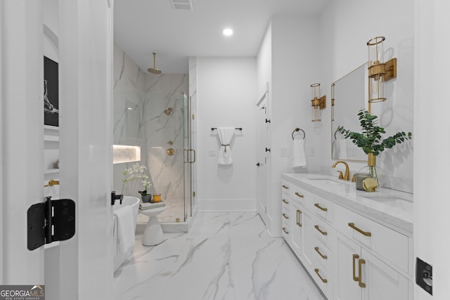 bathroom with marble finish floor, a marble finish shower, double vanity, recessed lighting, and a sink