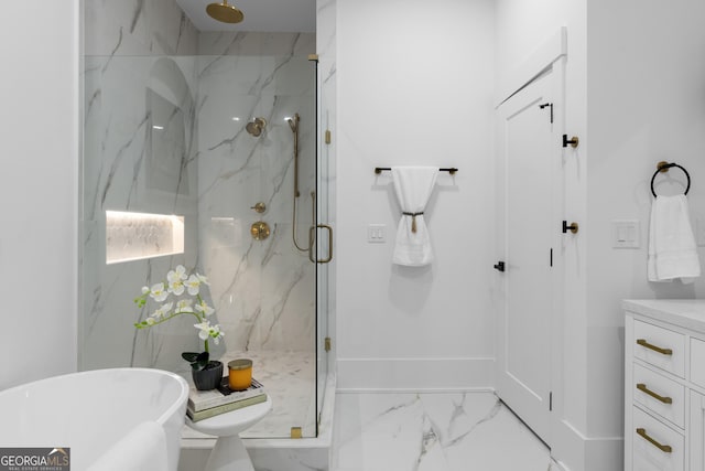 full bath featuring vanity, baseboards, marble finish floor, a soaking tub, and a marble finish shower