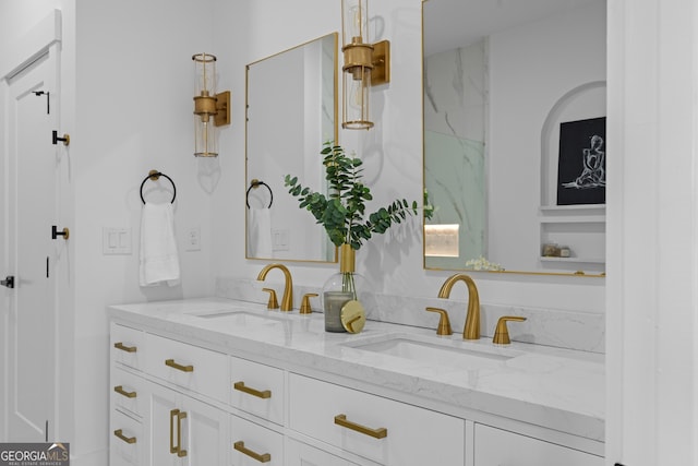 bathroom with a sink and double vanity