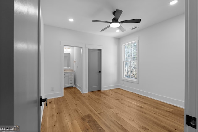 unfurnished bedroom with baseboards, light wood-style flooring, visible vents, and recessed lighting