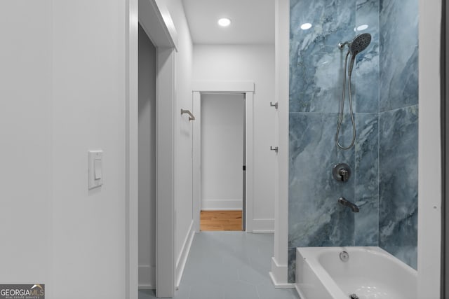 full bathroom with shower / washtub combination, baseboards, and tile patterned floors